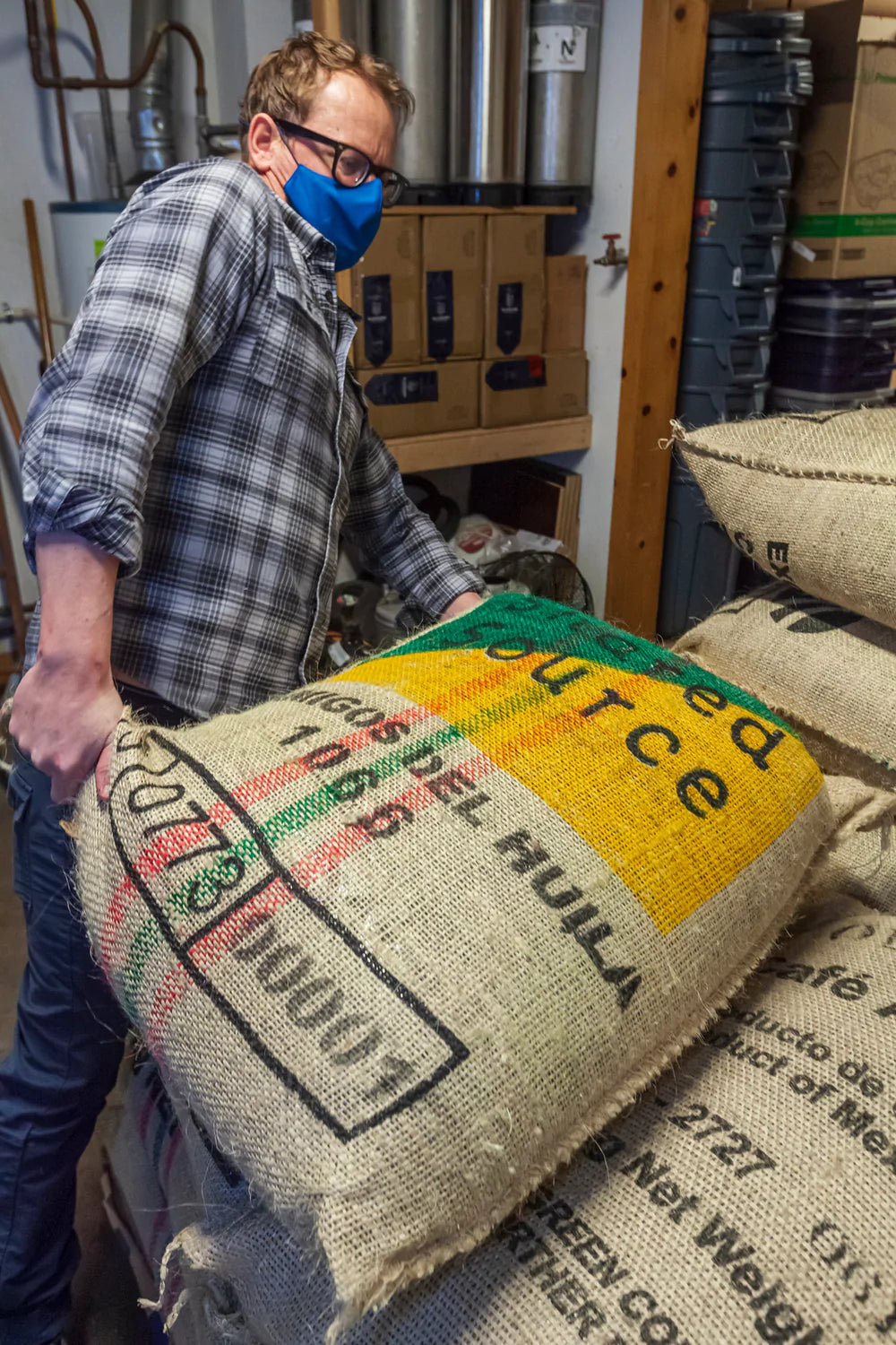 Kevin hauling green coffee bags