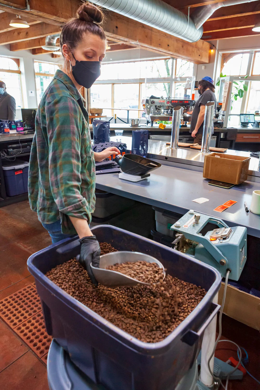 Person scooping coffee